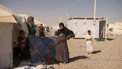 People from the town of Qaim outside their new homes in the Kilo 18 camp for displaced people from Anbar province in Iraq.