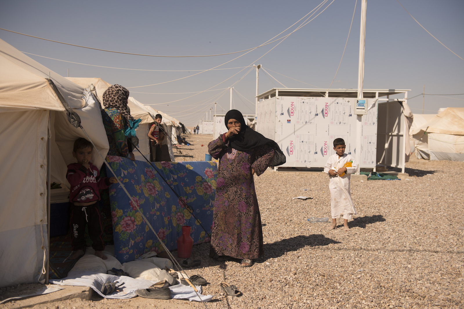 People from the town of Qaim outside their new homes in the Kilo 18 camp for displaced people from Anbar province in Iraq.