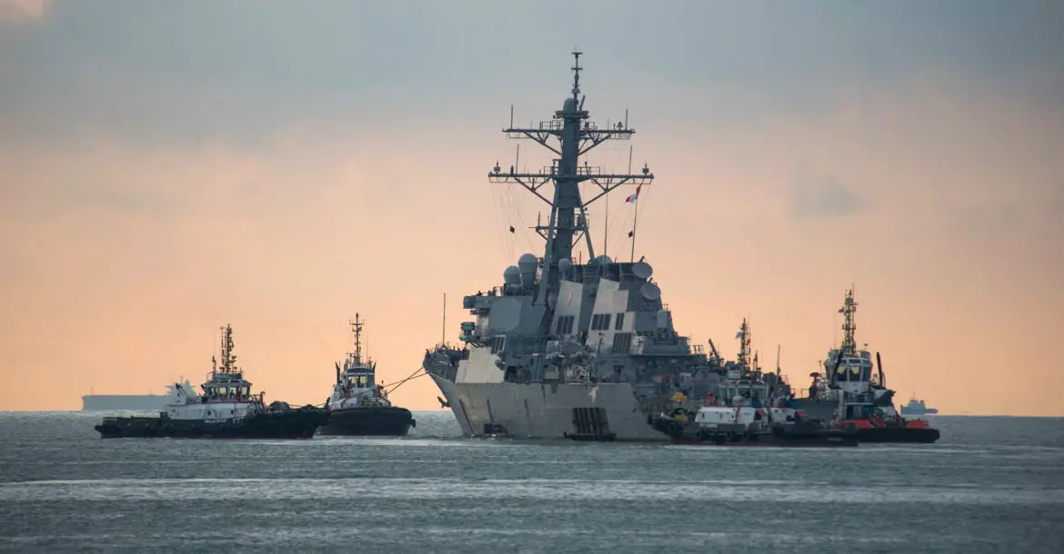 USS John S. McCain towed for transport
