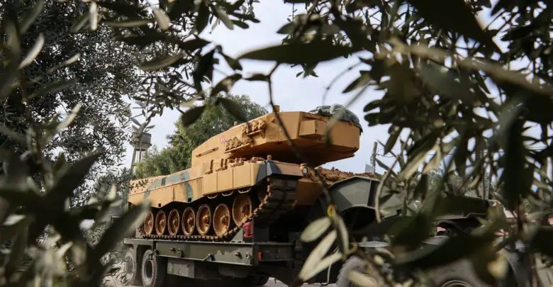 Turkish tank through olive trees