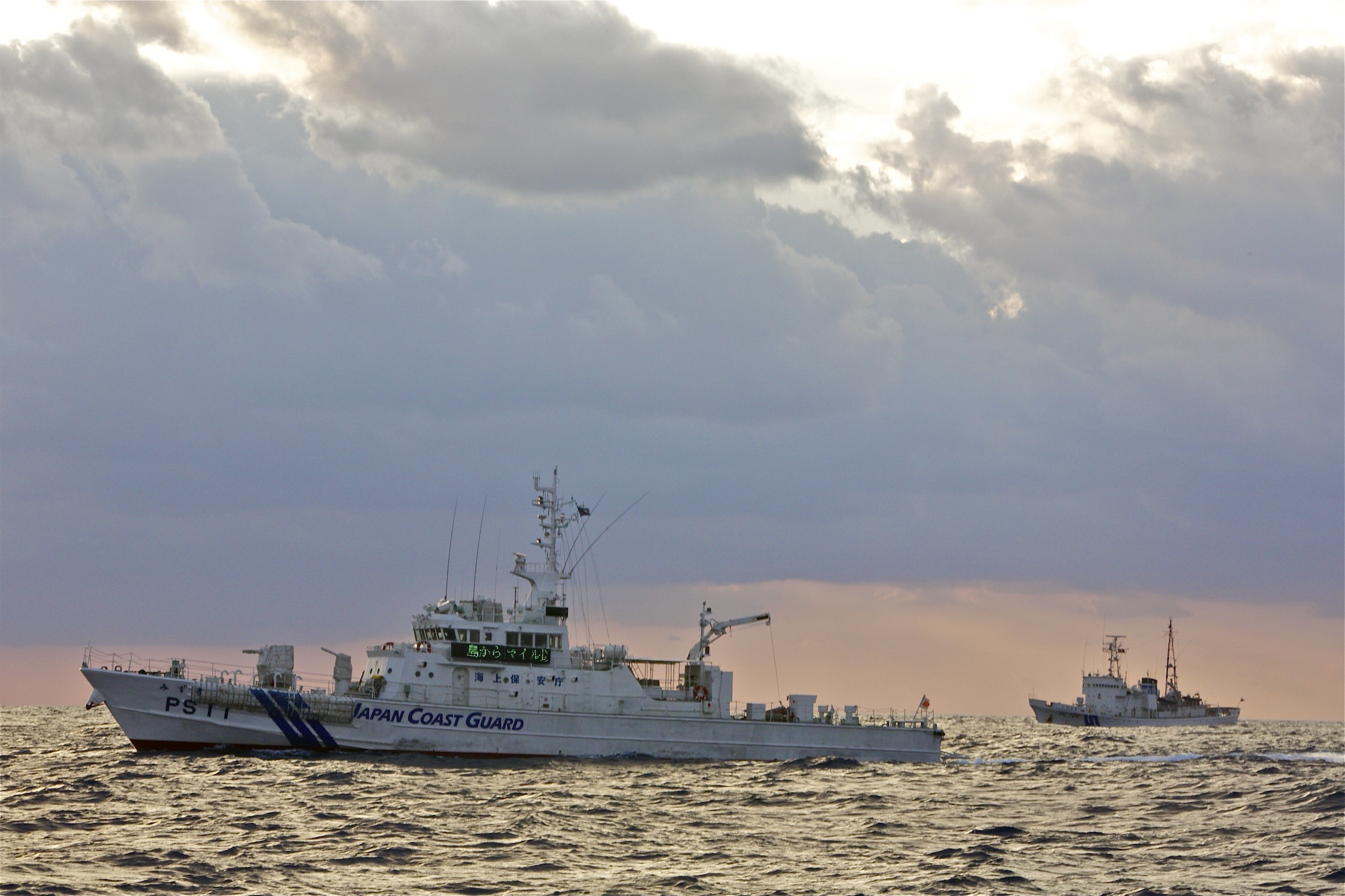 Japanese Coast Guard Cutters stand watch over the Senkaku islands/Diaoyu islands in 2012.