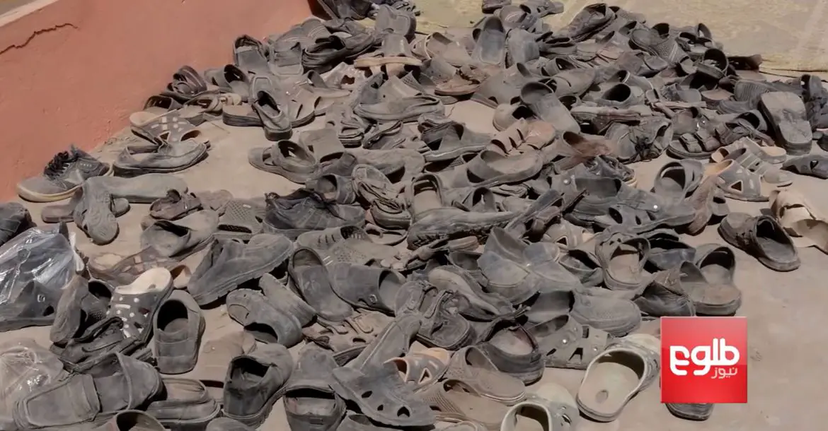 Shoes of victims of an Afghan Air Force airstrike at a religious school in a Taliban-controlled part of Dasht-e-Archi, Kunduz province