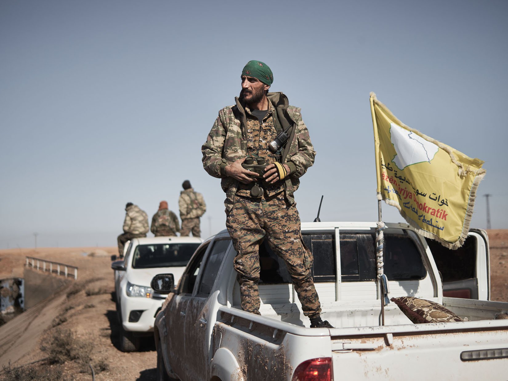 An SDF commander prepares his unit to enter Tal al-Samam
