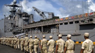 Royal Cambodian Marines embark aboard the amphibious dock landing ship USS Tortuga