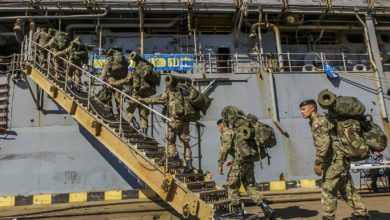 Romanian 307th Naval Infantry Battalion embarks with 26th MEU Marines aboard USS Oak Hill