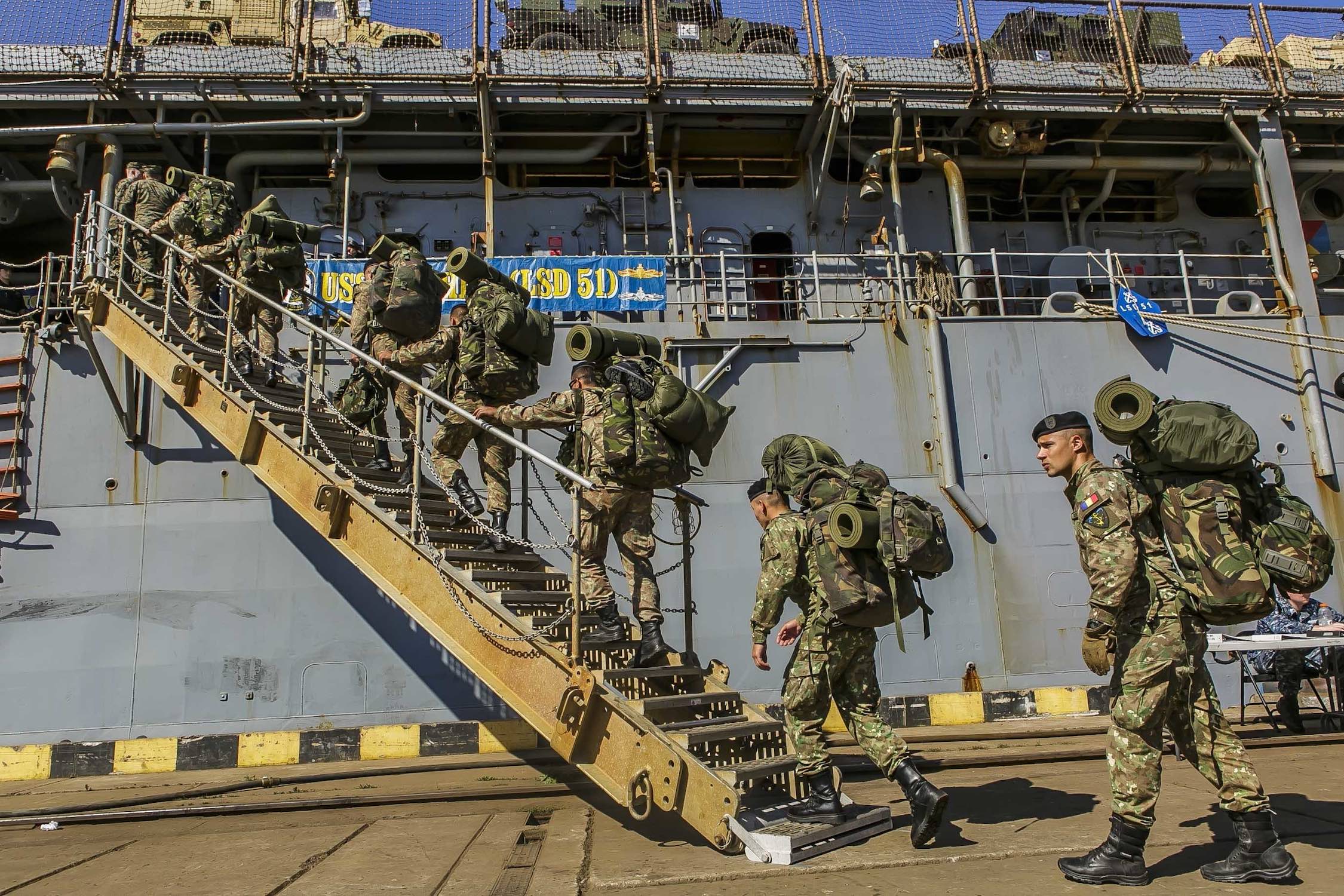Romanian 307th Naval Infantry Battalion embarks with 26th MEU Marines aboard USS Oak Hill