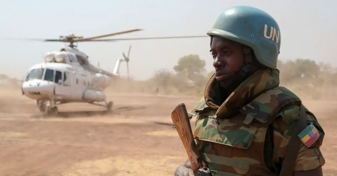 Ethiopian UNMISS peacekeeper guards helicopter