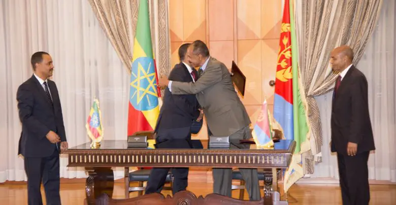 Ethiopian Prime Minister Abiy Ahmed (left) and Eritrean President Isaias Afwerki (right) hug after signing a Joint Declaration of Peace and Friendship at the state house in Asmara, Eritrea