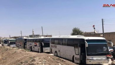 Buses enter the towns of Foua and Kafriya in Syria's Idlib province to evacuate residents to government-held territory.