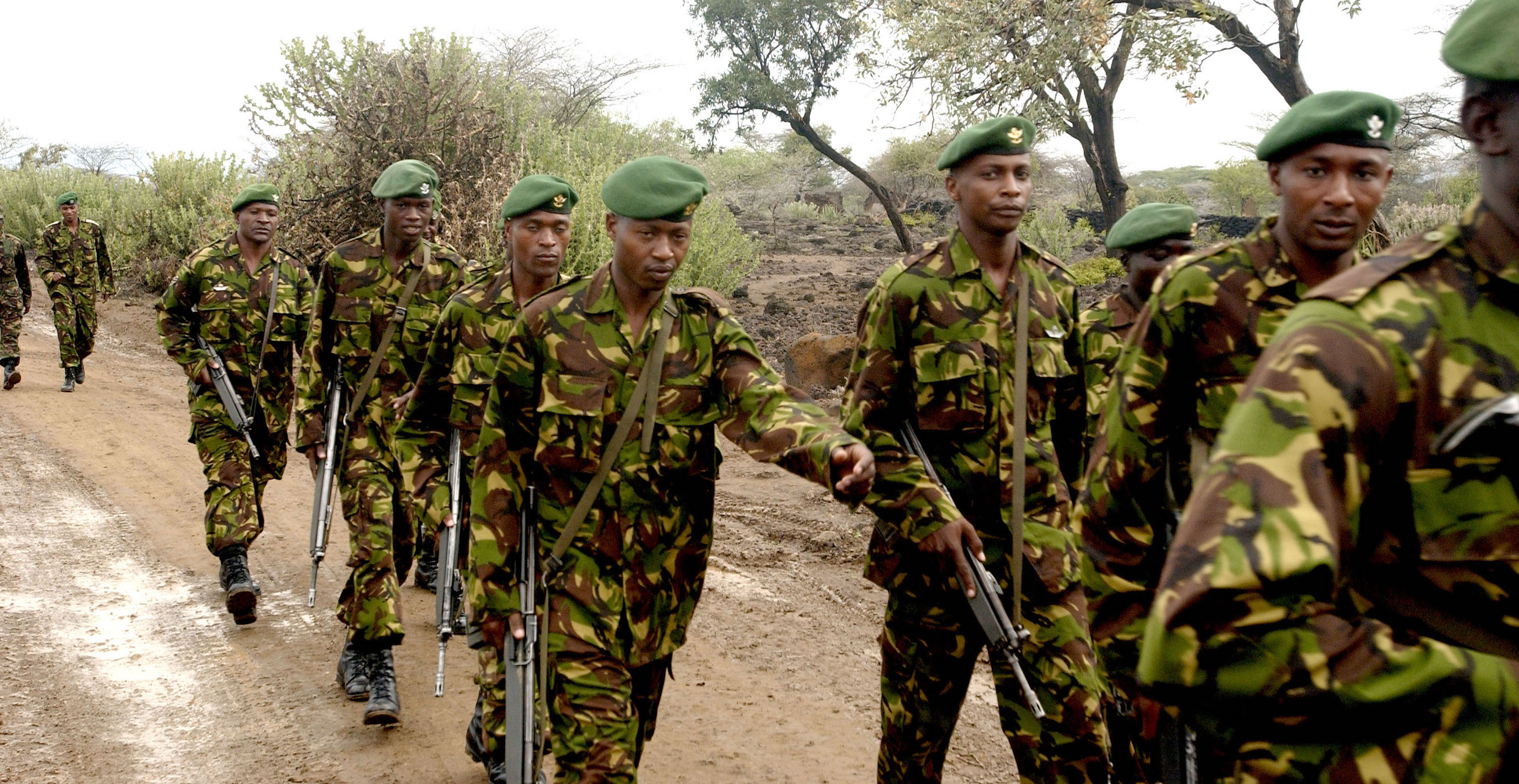 Kenya military personnel march in Nginyang Village