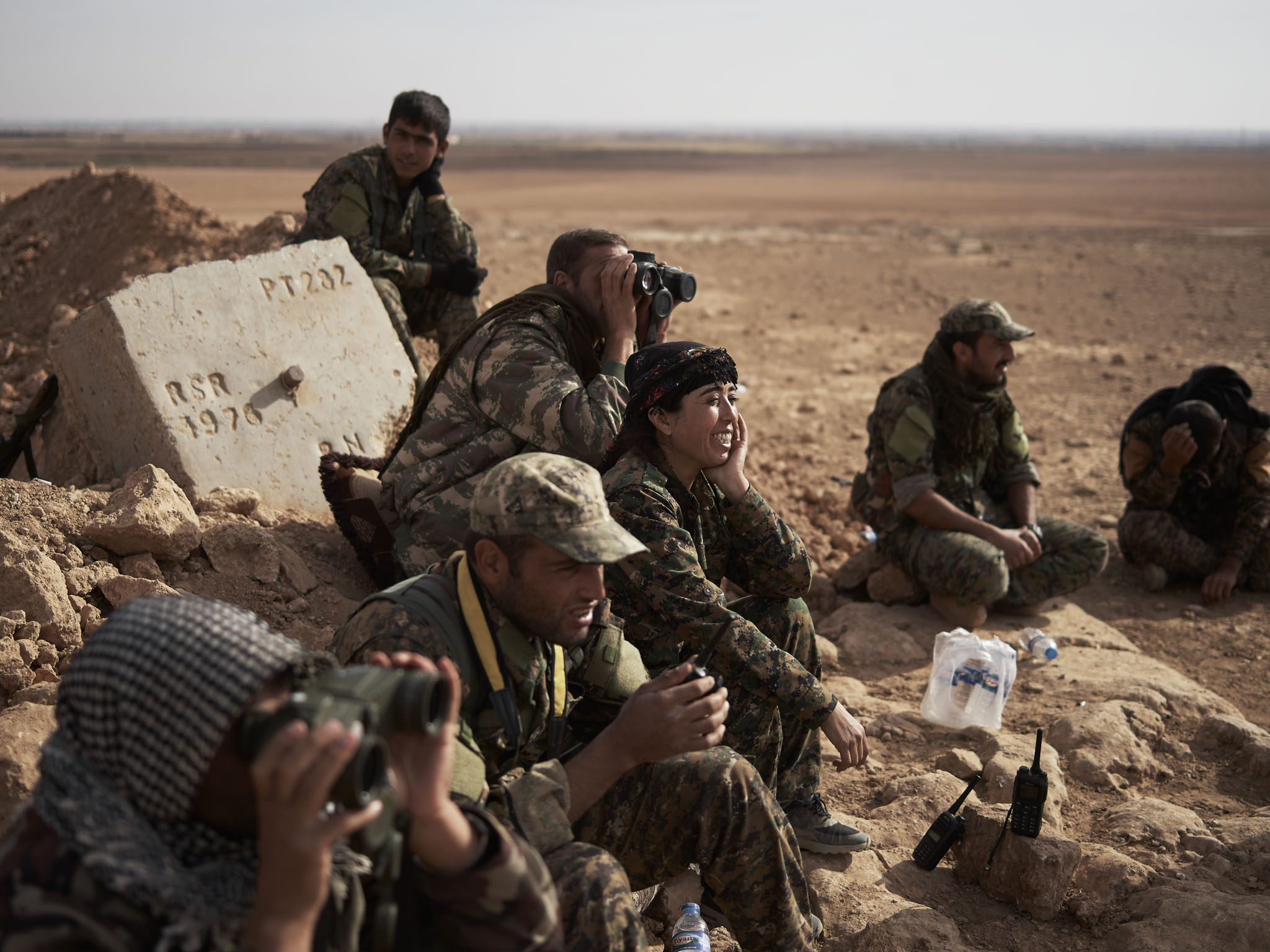 Rojda Felat surveys a flank of Tal al-Samam with other SDF commanders