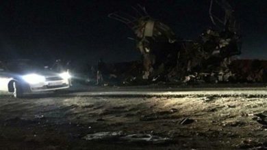 Cars at the scene of a roadside bomb attack on IRGC