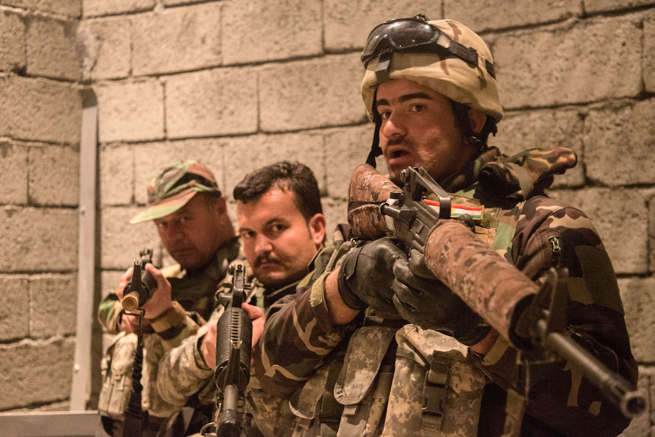 Peshmerga soldiers practice urban room clearing during training at Bneslawa, Iraq