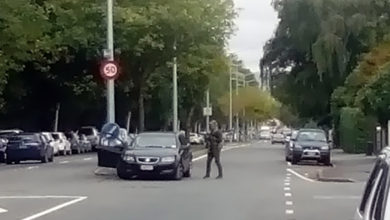 New Zealand police cordon a street near the mosque after a shooting in Christchurch