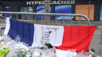 French flag outside the Hyper Cacher kosher market in Paris, France