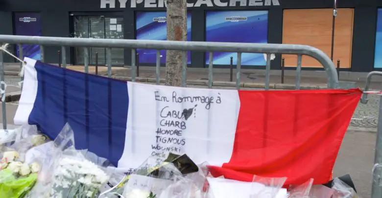 French flag outside the Hyper Cacher kosher market in Paris, France