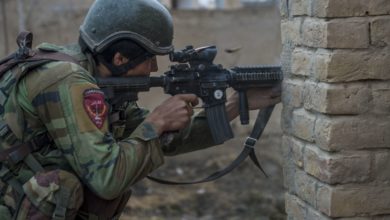 An Afghan national Army 10th Special Operations Kandak Commando returns fire during offensive operations against the Taliban in Kunduz province, Afghanistan, January 20, 2018.