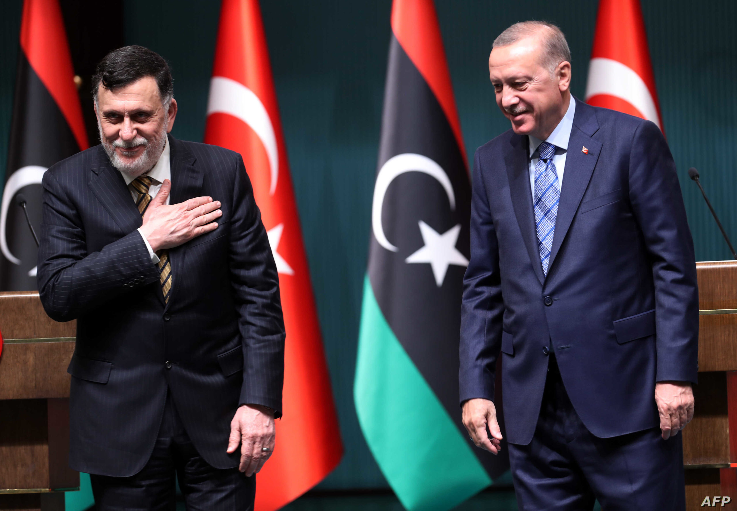 Turkish President Recep Tayyip Erdogan (R) and Libyan Prime Minister Fayez al-Sarraj hold a joint press conference at the Presidential Complex in Ankara on June 4, 2020.