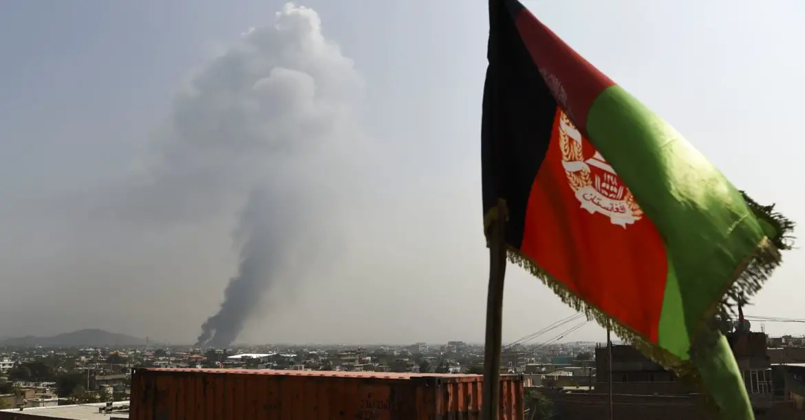 Smoke rises from the site of an attack after a massive explosion the night before near the Green Village in Kabul, September 2019.