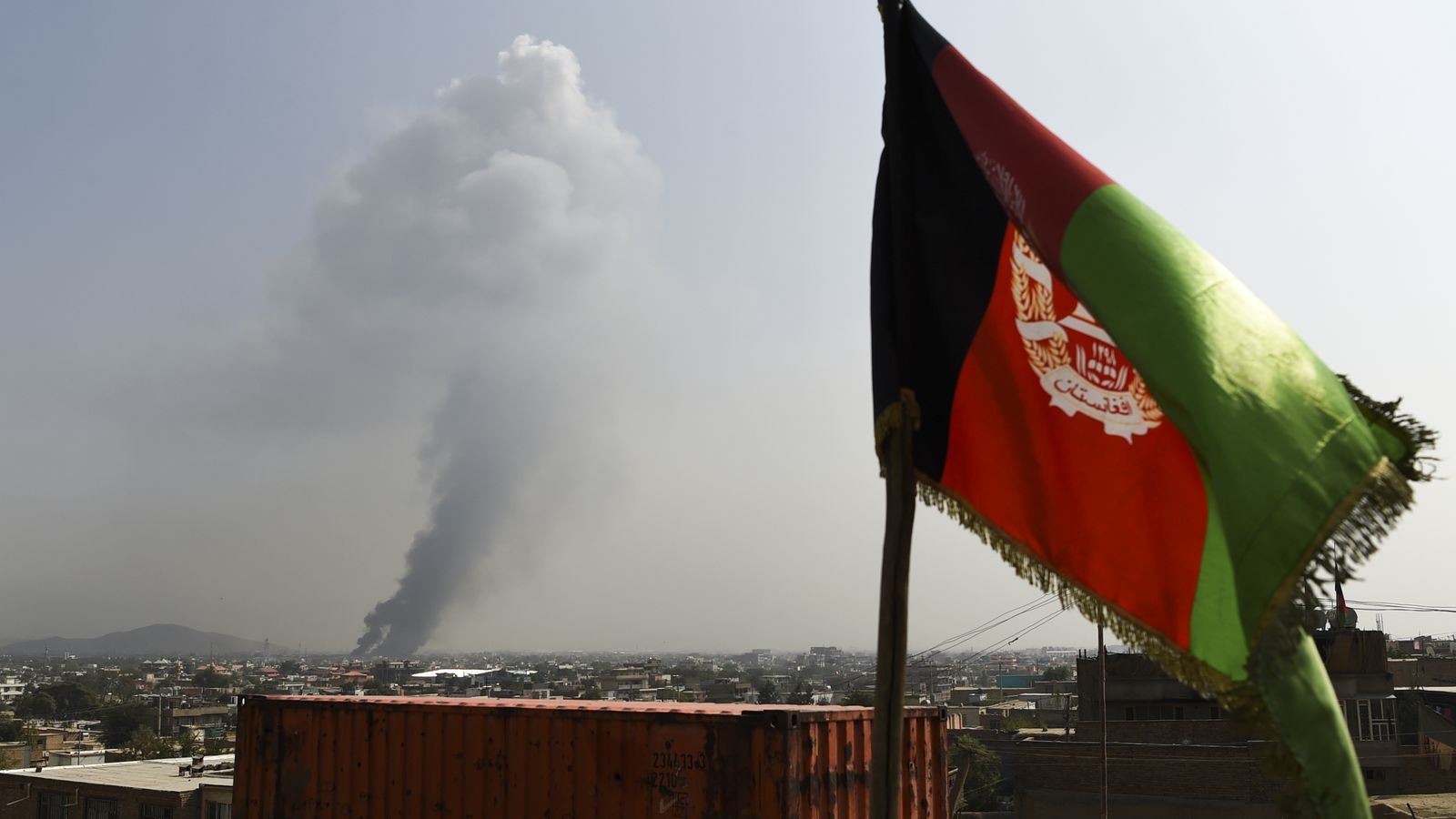 Smoke rises from the site of an attack after a massive explosion the night before near the Green Village in Kabul, September 2019.