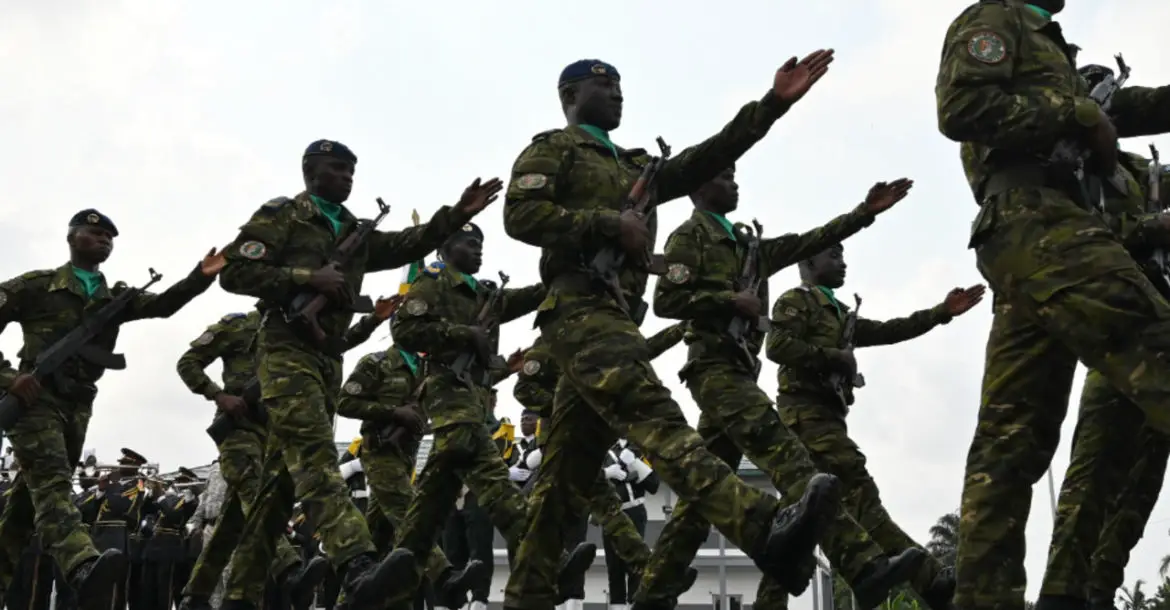 Ivory Coast army officers march during the funeral of Colonel Issiaka Ouattara,