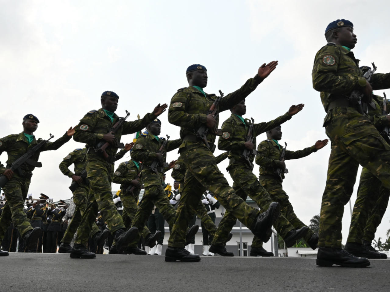 Ivory Coast army officers march during the funeral of Colonel Issiaka Ouattara,