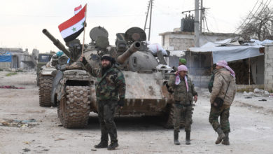 Syrian government forces deploy near the Damascus-Aleppo highway in the southern part of Syria's northern Aleppo province on February 10, 2020