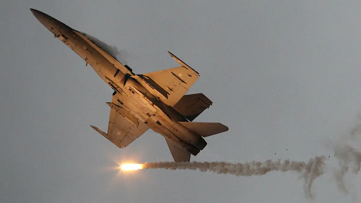A McDonnell Douglas F-18 Hornet military airplane of the Finnish Air Force emits so-called "flares" countermeasure munition during the International Air Show ILA in Schoenefeld near Berlin on September 15, 2012