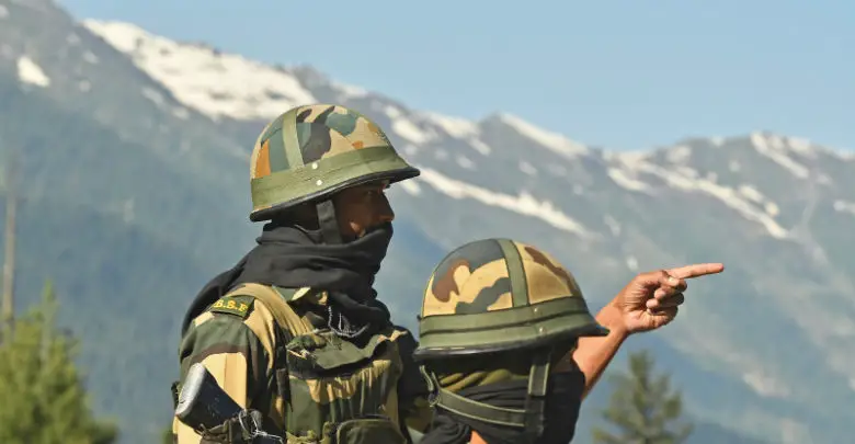 Indian Border Security Force (BSF) soldiers guard a highway leading towards Leh, bordering China, in Gagangir on June 17, 2020.