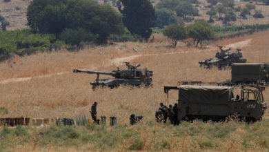 Armoured vehicles and 155 mm self-propelled howitzers deployed in the Upper Galilee in northern Israel on the border with Lebanon on July 27, 2020