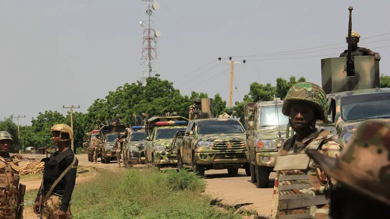 Nigerian soldiers patrol on October 12, 2019, after gunmen suspected of belonging to the Islamic State West Africa Province (ISWAP) group carried out a deadly attack in the village of Tungushe, Borno state
