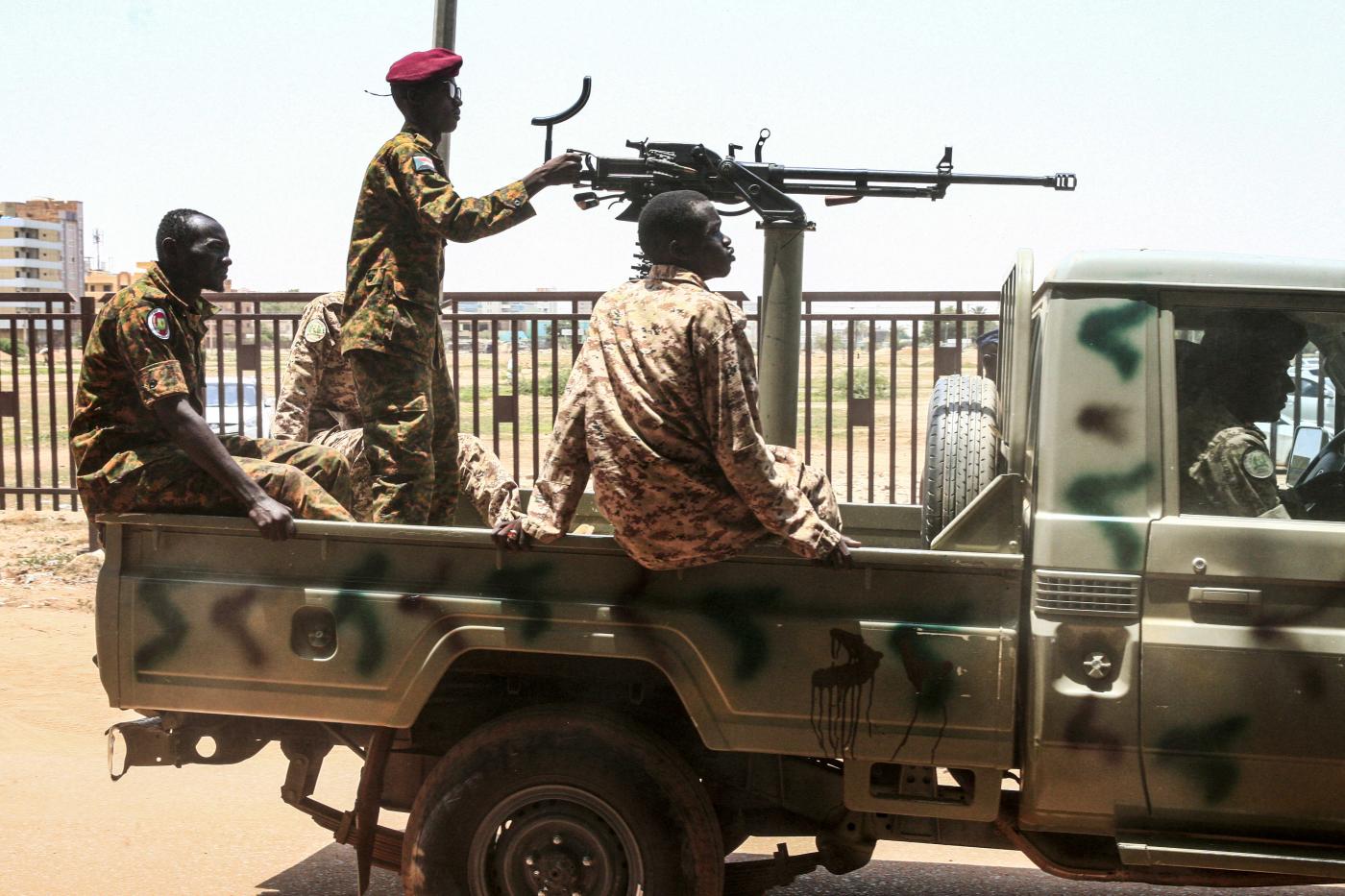 Sudanese soldiers seen in a convoy escorting Bashir back to prison after his appearance in court in Khartoum in August, 2019.