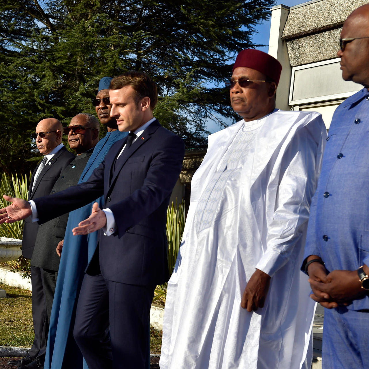 French President Emmanuel Macron (center) gestures during a joint news conference with his counterparts from five Sahel nations in Noukchott, Mauritania