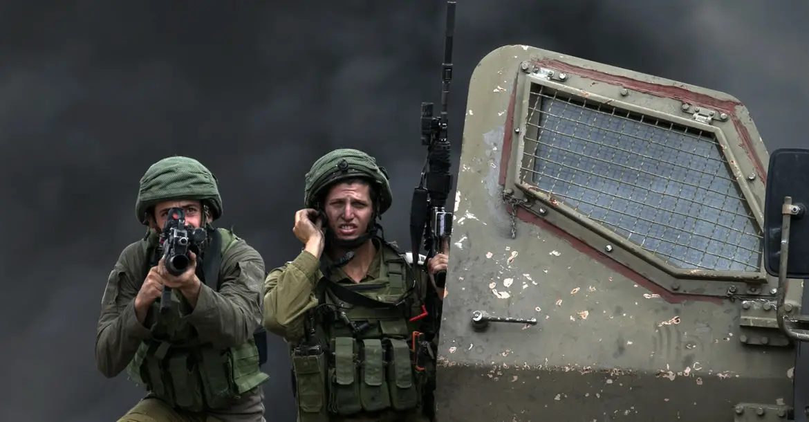 Two Israeli soldiers with armed weapons.