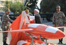 Brigadier-General Alireza Sabahifard, center, unveils the "Kian," a high-precision drone that can locate and attack targets far from the country's borders during a ceremony in the capital Tehran, September 2019.