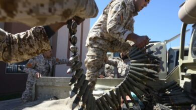 Fighters loyal to the Libyan Government of National Accord (GNA) prepare their ammunition.