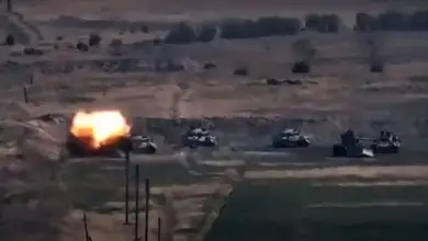 An image grab taken from a video made available on the official web site of the Armenian Defence Ministry on September 27, 2020, allegedly shows destroying of Azeri military vehicles during clashes between Armenian separatists and Azerbaijan in the breakaway region of Nagorno-Karabakh
