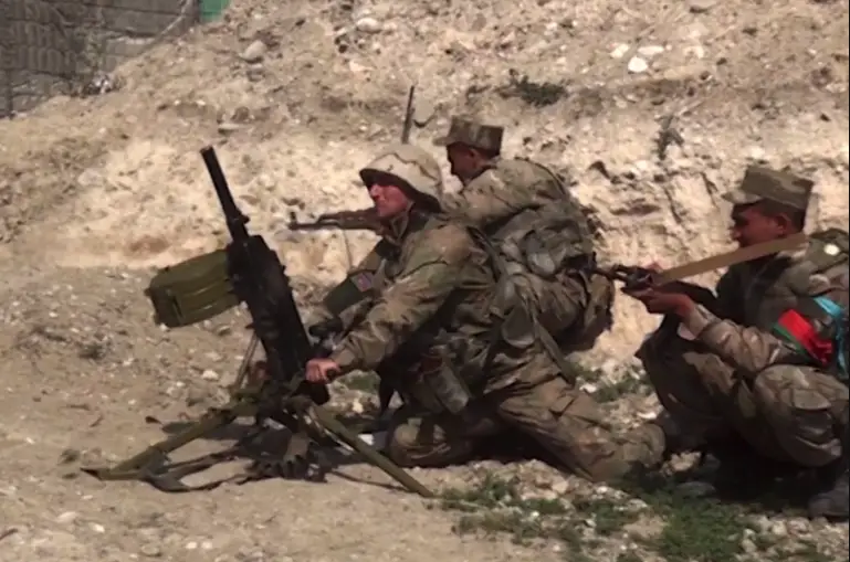 An image grab taken from a video made available on the official web site of the Azerbaijani Defence Ministry on 28 September 28, 2020, allegedly shows Azeri troops conducting a combat operation during clashes between Armenian separatists and Azerbaijan in the breakaway region of Nagorno Karabakh