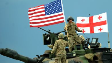 US servicemen stand atop a M1A2 Abrams tank during the Noble Partner 2016 joint military exercise at the Vaziani training area outside Tbilisi on May 24, 2016