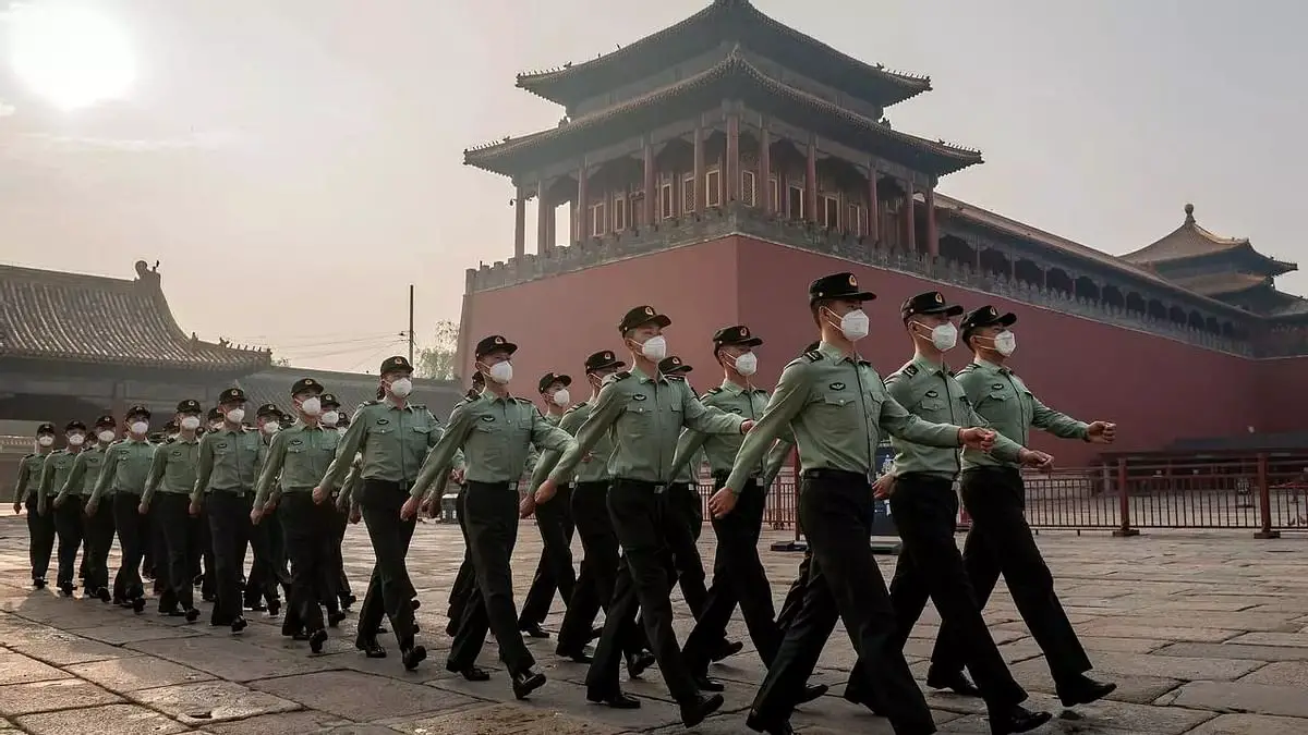 People's Liberation Army (PLA) soldiers march during the opening ceremony of the Chinese People's Political Consultative Conference (CPPCC) in Beijing