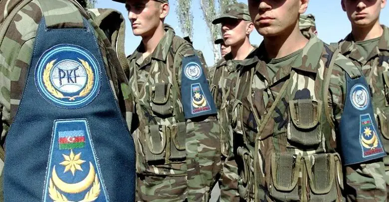 Members of the Azerbaijan Army pass in review during CENTRASBAT (Central Asian Peacekeeping Battalion) 2000 opening ceremonies on September 13th, 2000.