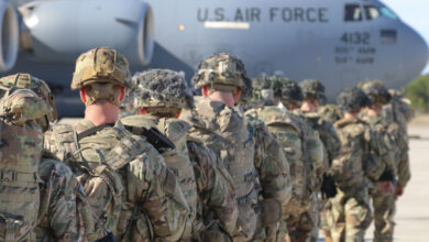 This handout picture released by the US Army shows U.S. Army Paratroopers assigned to the 2nd Battalion, 504th Parachute Infantry Regiment, 1st Brigade Combat Team, 82nd Airborne Division, deploy from Pope Army Airfield, North Carolina on January 1, 2020