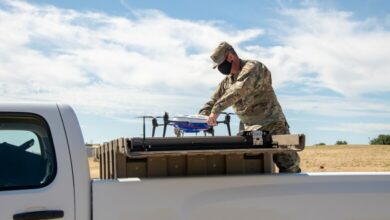 U.S. Air Force Master Sgt. Joshua Hicks, 60th Security Forces Squadron flight chief, secures an Easy Aerial drone inside of the ground charging station July 10, 2020, at Travis Air Force Base, California.