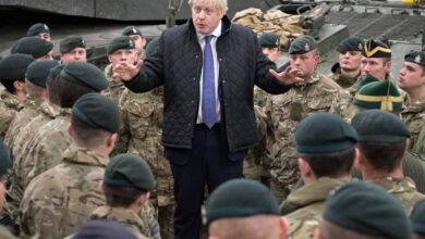 Britain's Prime Minister Boris Johnson speaks with troops.