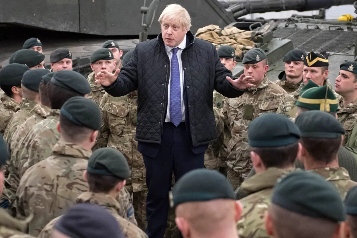 Britain's Prime Minister Boris Johnson speaks with troops.