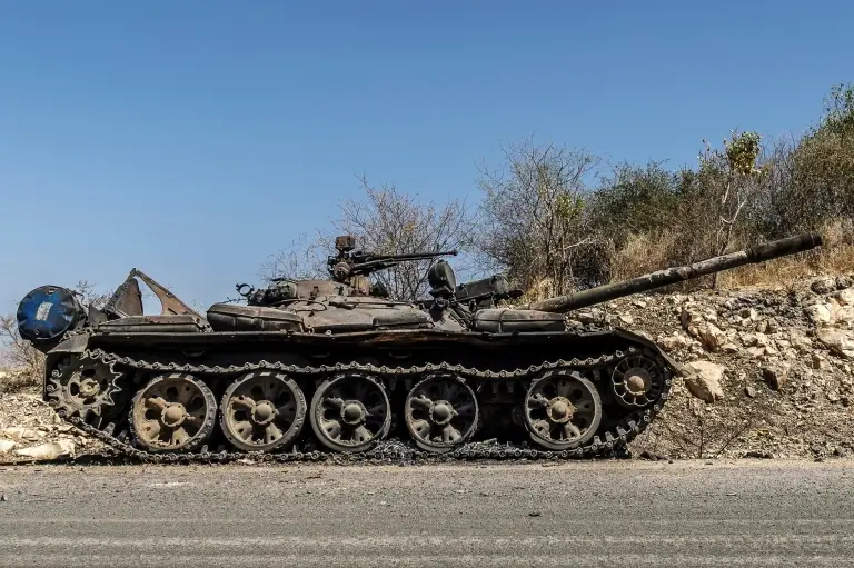 A damaged tank is abandoned on a road near Humera, Ethiopia, November 22, 2020