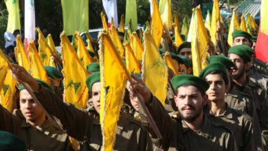 Hezbollah fighters take part in a military parade marking the group's Martyrs' Day in the southern town of Ghazieh, south of the port city of Sidon, 12 November 2019