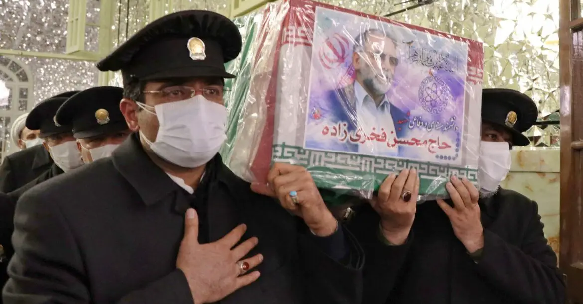 Servants carry the coffin of Iran's assassinated top nuclear scientist Mohsen Fakhrizadeh