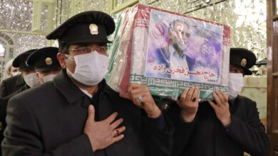 Servants carry the coffin of Iran's assassinated top nuclear scientist Mohsen Fakhrizadeh