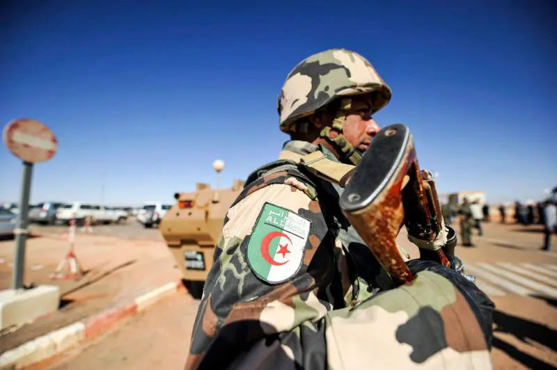 Photo of an Algerian soldier standing guard at the Tiguentourine gas complex, in In Amenas, about 1,600 kilometres southeast of the capital.